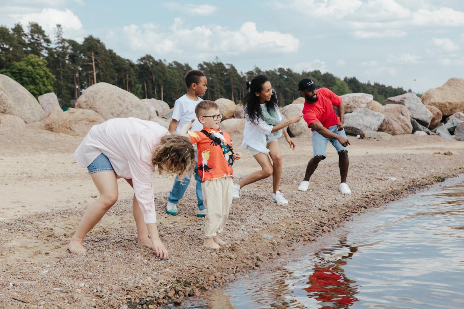 Photograph of a family playing on a beach